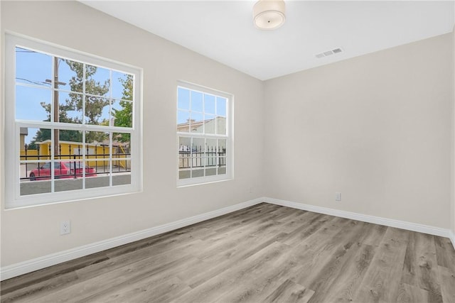 339 E 8th St, Azusa, CA 91702 - unfurnished room with wood finished floors and baseboards