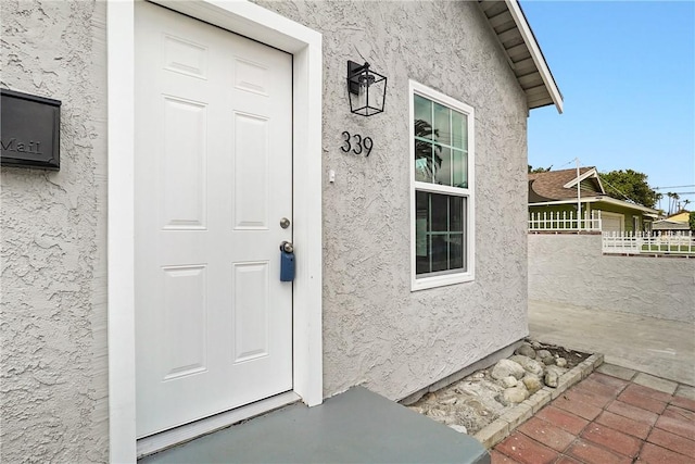 339 E 8th St, Azusa, CA 91702 - property entrance featuring stucco siding