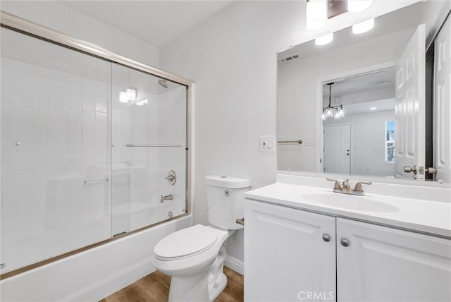 339 E 8th St, Azusa, CA 91702 - bathroom with vanity, bath / shower combo with glass door, and wood finished floors