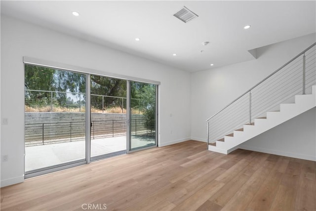 957 Figueroa Unit 318, Los Angeles, CA 90012 - unfurnished room with stairway, light wood-style floors, and recessed lighting
