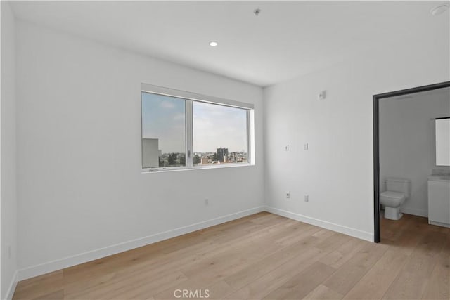 957 Figueroa Unit 318, Los Angeles, CA 90012 - unfurnished bedroom featuring light wood-type flooring, recessed lighting, and ensuite bath