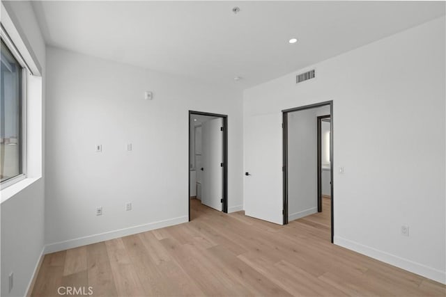 957 Figueroa Unit 318, Los Angeles, CA 90012 - unfurnished bedroom featuring light wood-type flooring and recessed lighting