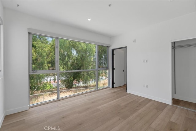 957 Figueroa Unit 318, Los Angeles, CA 90012 - unfurnished bedroom with light wood-style flooring and recessed lighting