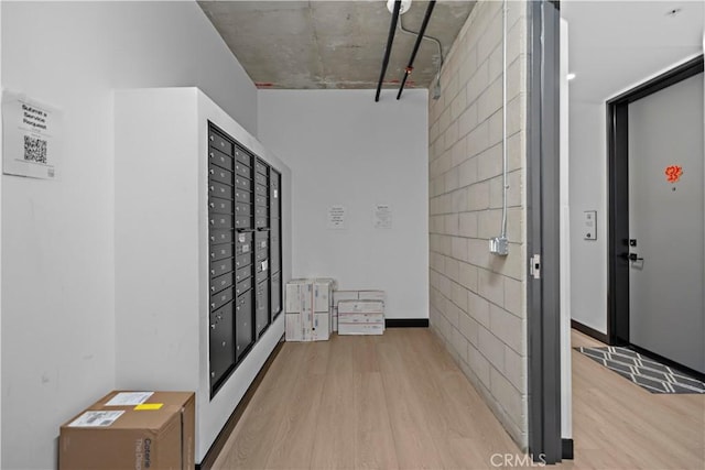 957 Figueroa Unit 318, Los Angeles, CA 90012 - corridor featuring wood finished floors, mail area, and tile walls