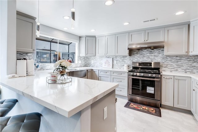 456 W Huntington Dr Unit C, Arcadia, CA 91007 - kitchen featuring stainless steel gas range oven, under cabinet range hood, a peninsula, tasteful backsplash, and recessed lighting