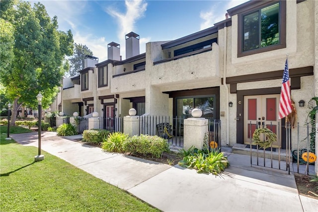 456 W Huntington Dr Unit C, Arcadia, CA 91007 - view of front of property featuring stucco siding and a chimney