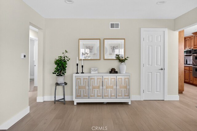 1303 E Monroe Ave, Orange, CA 92867 - hall featuring light wood finished floors and baseboards