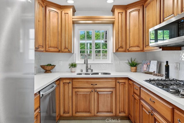 1303 E Monroe Ave, Orange, CA 92867 - kitchen with appliances with stainless steel finishes, tasteful backsplash, light countertops, and recessed lighting