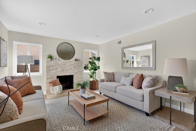 1303 E Monroe Ave, Orange, CA 92867 - living room with a fireplace and light wood finished floors