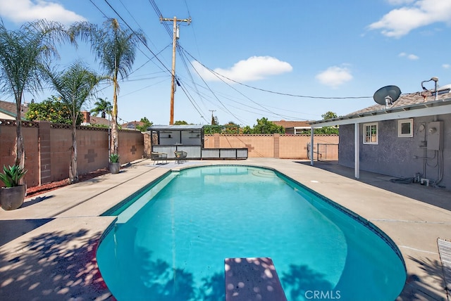 1303 E Monroe Ave, Orange, CA 92867 - view of swimming pool with a diving board, a fenced backyard, and a patio