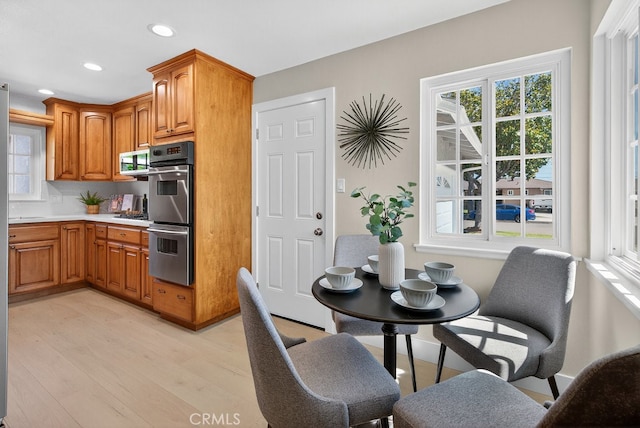 1303 E Monroe Ave, Orange, CA 92867 - kitchen with light wood-style flooring, stainless steel appliances, recessed lighting, light countertops, and healthy amount of natural light