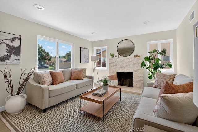 1303 E Monroe Ave, Orange, CA 92867 - living room with a stone fireplace, wood finished floors, and recessed lighting