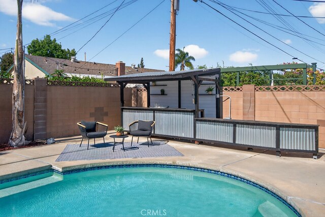 1303 E Monroe Ave, Orange, CA 92867 - view of pool featuring a patio and a fenced backyard