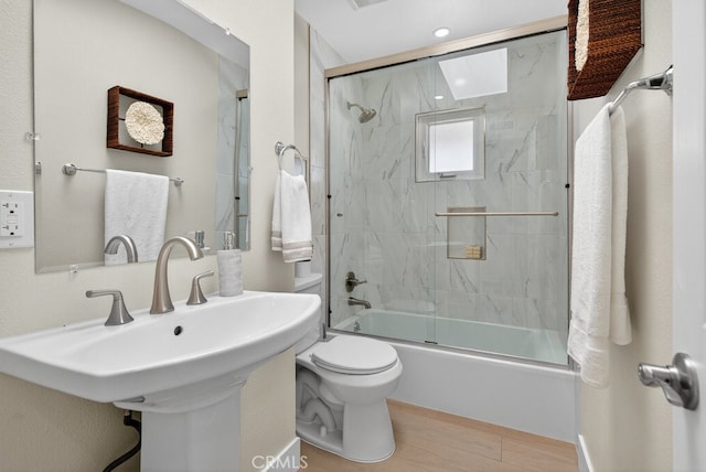 1303 E Monroe Ave, Orange, CA 92867 - full bath featuring enclosed tub / shower combo and wood finished floors