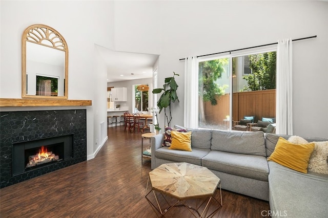 10 Cumberland Ln, Aliso Viejo, CA 92656 - living room with wood finished floors, a fireplace, and a towering ceiling
