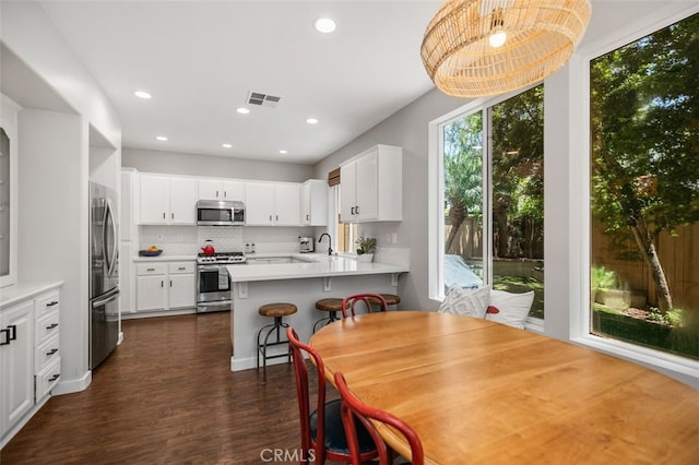 10 Cumberland Ln, Aliso Viejo, CA 92656 - dining room with dark wood finished floors and recessed lighting