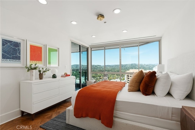 10490 Wilshire Blvd Unit 2704, Los Angeles, CA 90024 - bedroom featuring access to exterior, multiple windows, and recessed lighting