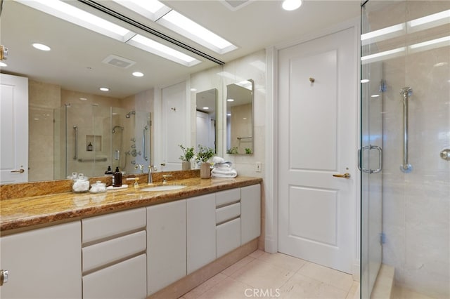 10490 Wilshire Blvd Unit 2704, Los Angeles, CA 90024 - full bathroom with a shower stall, vanity, tile patterned floors, and recessed lighting