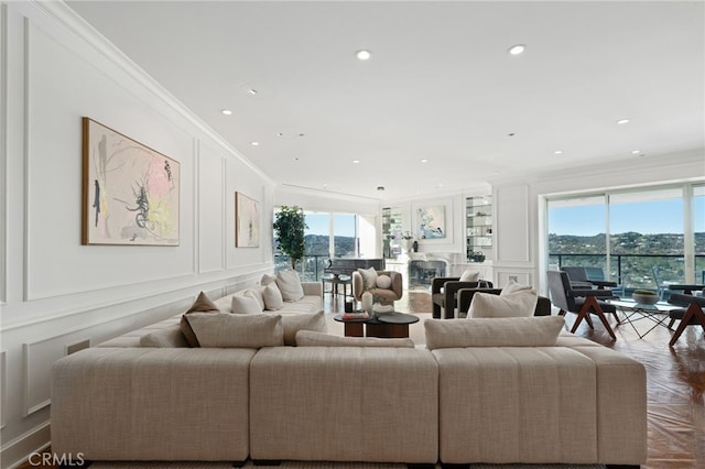 10490 Wilshire Blvd Unit 2704, Los Angeles, CA 90024 - living area with a decorative wall, crown molding, and recessed lighting