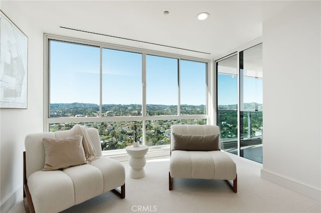 10490 Wilshire Blvd Unit 2704, Los Angeles, CA 90024 - sitting room with plenty of natural light, carpet floors, and expansive windows