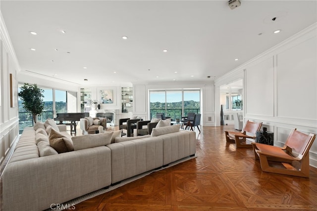10490 Wilshire Blvd Unit 2704, Los Angeles, CA 90024 - living area featuring a decorative wall, ornamental molding, healthy amount of natural light, and recessed lighting