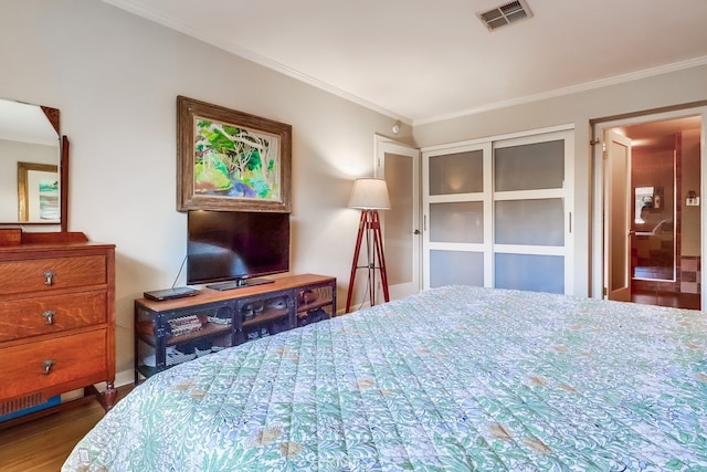 2015 E Broadway Unit 402, Long Beach, CA 90803 - bedroom with crown molding and wood finished floors