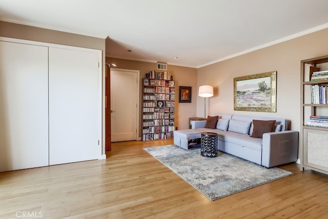 2015 E Broadway Unit 402, Long Beach, CA 90803 - living room featuring crown molding and light wood-type flooring