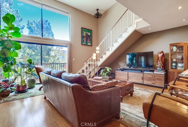 2015 E Broadway Unit 402, Long Beach, CA 90803 - living room featuring stairway, wood finished floors, and recessed lighting