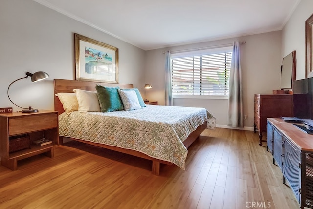 2015 E Broadway Unit 402, Long Beach, CA 90803 - bedroom with crown molding and light wood-style floors
