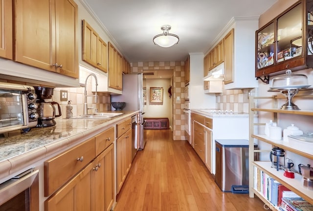 2015 E Broadway Unit 402, Long Beach, CA 90803 - kitchen featuring tasteful backsplash, light wood-style floors, dishwasher, wine cooler, and white stovetop