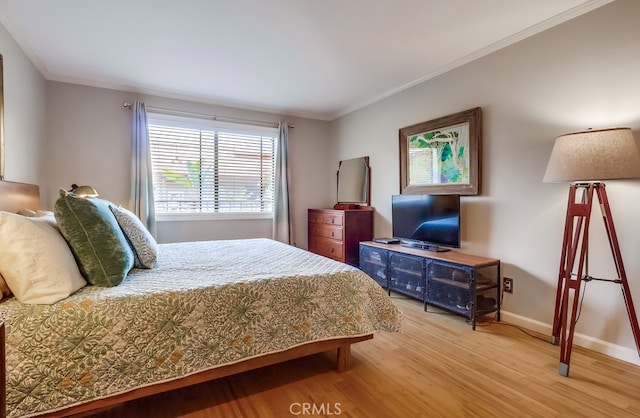 2015 E Broadway Unit 402, Long Beach, CA 90803 - bedroom featuring light wood-style flooring and ornamental molding
