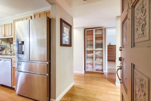2015 E Broadway Unit 402, Long Beach, CA 90803 - kitchen with stainless steel fridge, dishwasher, light wood-type flooring, and light countertops