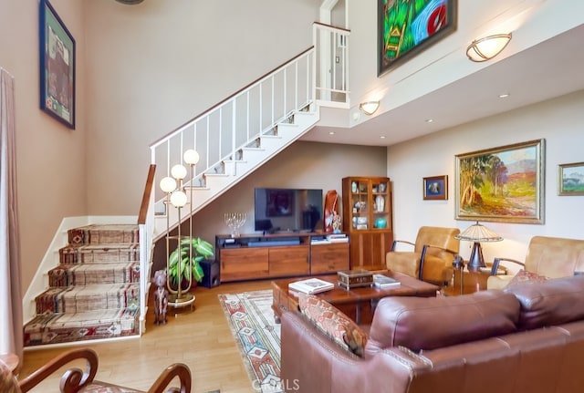 2015 E Broadway Unit 402, Long Beach, CA 90803 - living area featuring stairway, wood finished floors, and recessed lighting