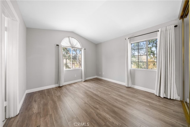 13199 Spire Cir, Chino Hills, CA 91709 - unfurnished room featuring healthy amount of natural light, wood finished floors, and lofted ceiling
