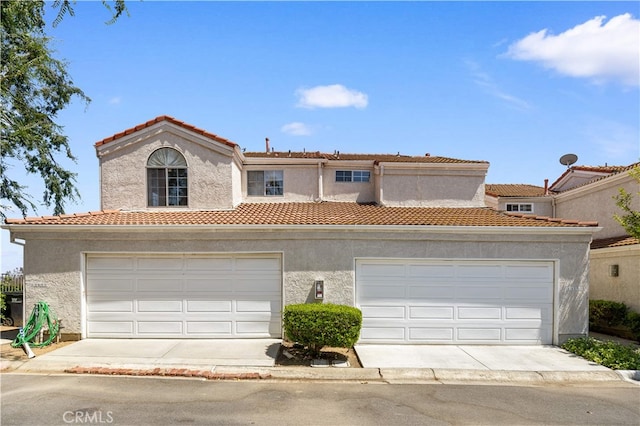 13199 Spire Cir, Chino Hills, CA 91709 - mediterranean / spanish house featuring a tiled roof, a garage, and stucco siding