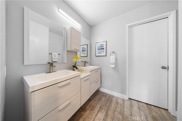 13199 Spire Cir, Chino Hills, CA 91709 - full bathroom featuring double vanity and wood finished floors