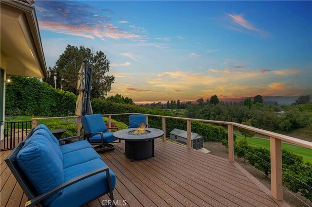 1525 Ramona Dr, Camarillo, CA 93010 - wooden deck with a fire pit