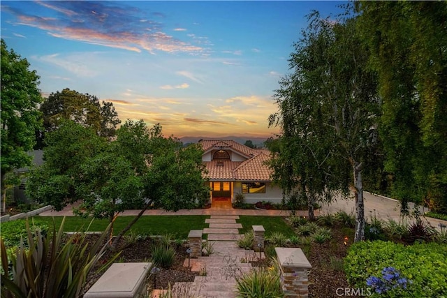 1525 Ramona Dr, Camarillo, CA 93010 - view of property hidden behind natural elements featuring a tiled roof and stucco siding