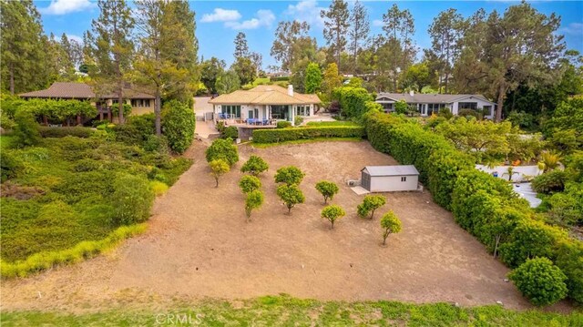 1525 Ramona Dr, Camarillo, CA 93010 - view of yard featuring view of wooded area and an outbuilding