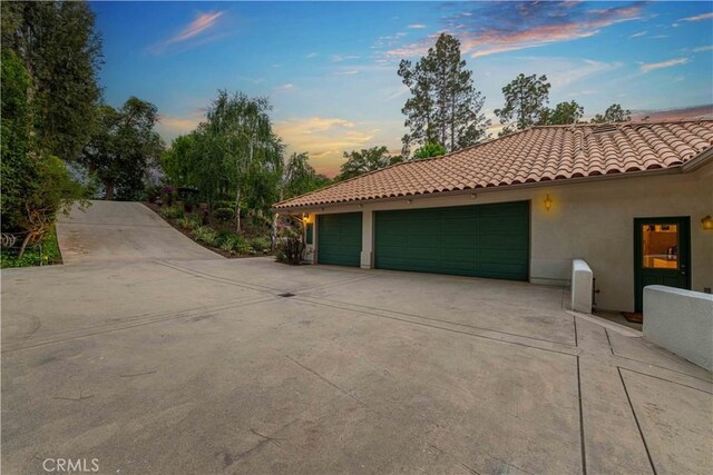 1525 Ramona Dr, Camarillo, CA 93010 - view of front facade with a tile roof, concrete driveway, stucco siding, and an attached garage