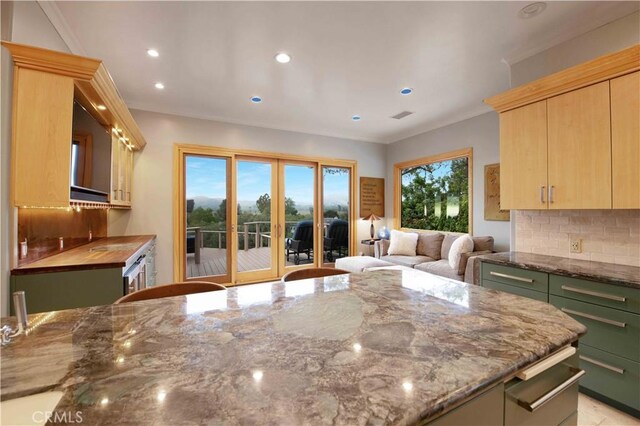 1525 Ramona Dr, Camarillo, CA 93010 - kitchen featuring light brown cabinetry, stone counters, backsplash, recessed lighting, and open floor plan