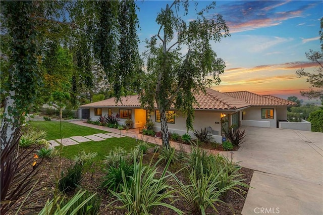 1525 Ramona Dr, Camarillo, CA 93010 - view of front of house with concrete driveway, stucco siding, a tiled roof, and a front yard