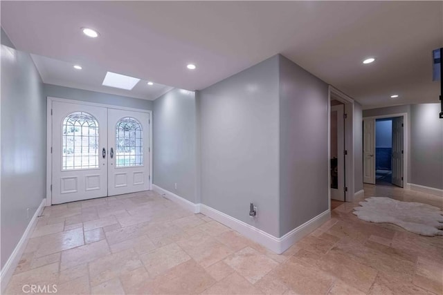1525 Ramona Dr, Camarillo, CA 93010 - entryway featuring a skylight, stone tile floors, recessed lighting, and french doors