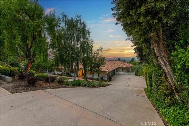 1525 Ramona Dr, Camarillo, CA 93010 - view of front facade featuring concrete driveway, a tile roof, a garage, and stucco siding