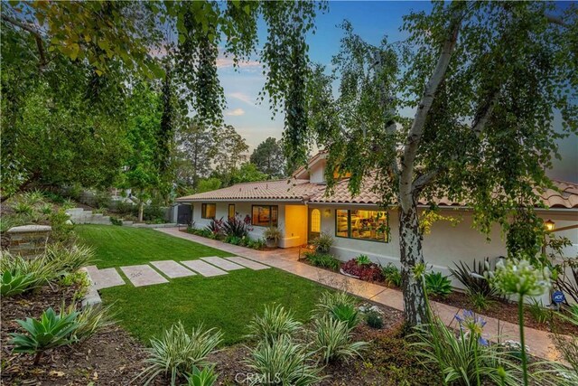 1525 Ramona Dr, Camarillo, CA 93010 - view of front facade featuring a front lawn, stucco siding, and a tile roof