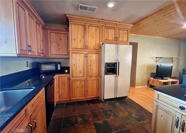 44293 Copper Creek Way, Coarsegold, CA 93614 - kitchen featuring black appliances, dark countertops, brown cabinetry, a desk, and recessed lighting