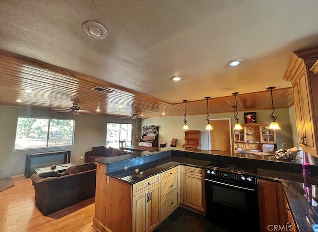 44293 Copper Creek Way, Coarsegold, CA 93614 - kitchen featuring dark countertops, open floor plan, black range with electric cooktop, a peninsula, and ceiling fan