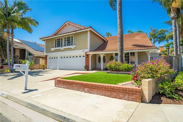 9921 Oceancrest Dr, Huntington Beach, CA 92646 - traditional-style home featuring an attached garage, stucco siding, driveway, and a tile roof
