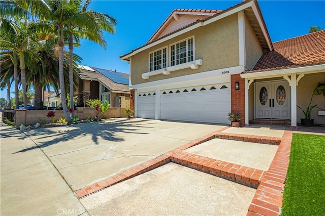 9921 Oceancrest Dr, Huntington Beach, CA 92646 - traditional-style home featuring a garage, driveway, stucco siding, and a tiled roof