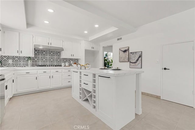 9921 Oceancrest Dr, Huntington Beach, CA 92646 - kitchen with a raised ceiling, backsplash, white cabinets, open shelves, and light tile patterned flooring